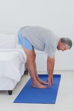 Senior male doing yoga