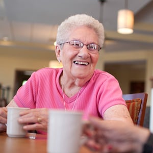 older white woman with coffee cup