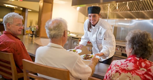 Highview Hills chef presents food to seniors at bar