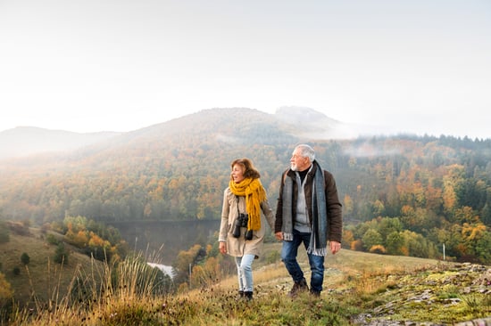 couple walking in the wilderness in the fall
