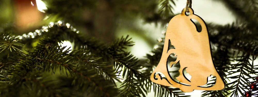 bell ornament hanging on christmas tree