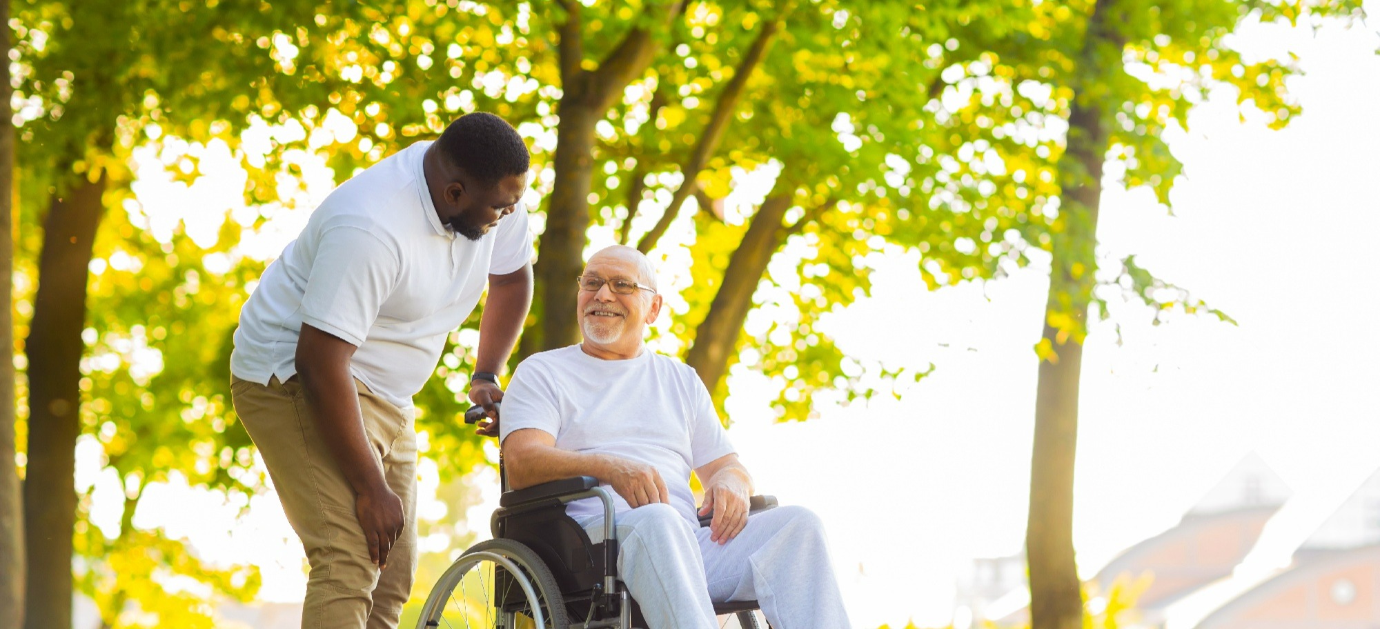 man speaking with another man in wheelchair