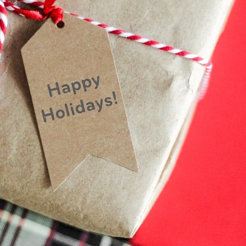 package with "happy holidays!" tag
