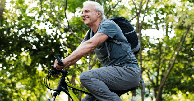 Senior man riding bike