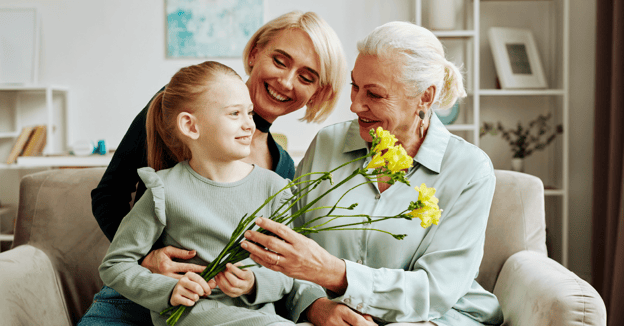 Senior woman visiting her daughter and grandchild